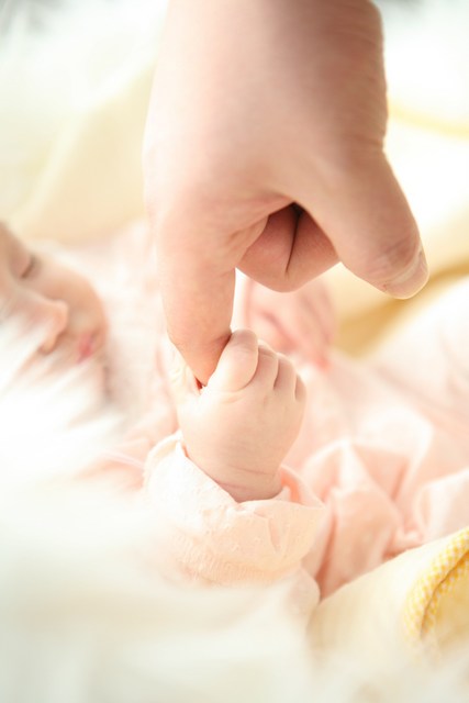 Baby holding hand